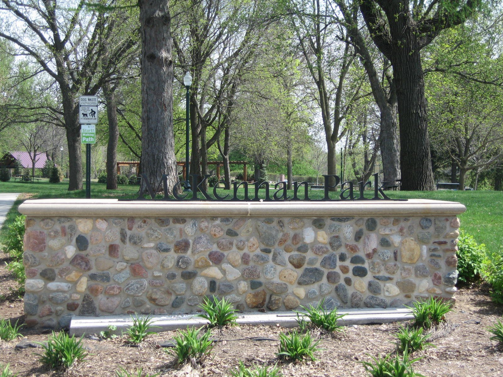 The entrance wall and floral nameplate